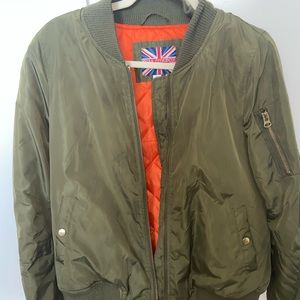 Olive green bomber jacket with orange interior